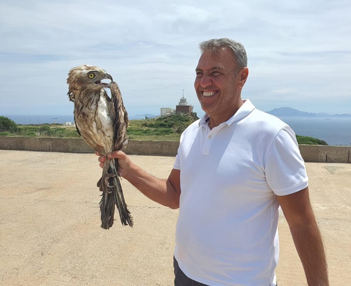 Stanley Olivero with a wet Short-toed eagle